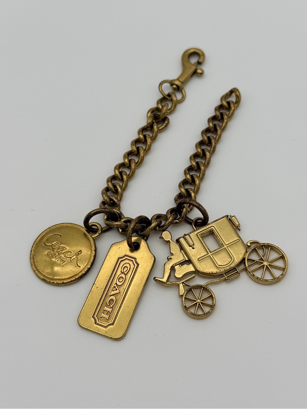 COACH Brass Charm Bracelet with Coach Tags & Horse Carriage Charm